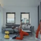 Robot aspirador en una casa moderna con base de carga, ideal para ilustrar el mejor robot aspirador gama alta y la comodidad doméstica.